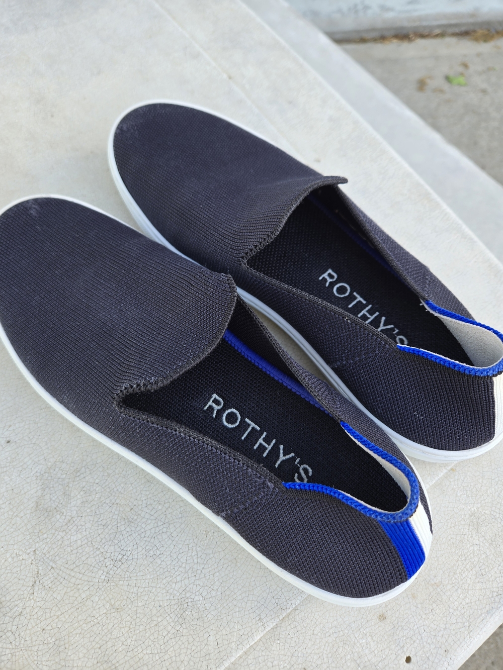 Rothy's Women's Black Slip-On Loafers with Blue Trim